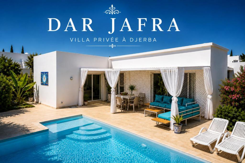 a villa with a swimming pool in front of a house at Villa avec Piscine Privée à Djerba Dar Jafra in Houmt Souk