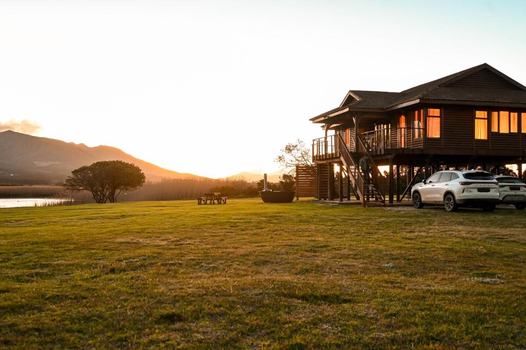 a house with a car parked in front of it at Rivers End Farm Stanford - Cabins in Stanford