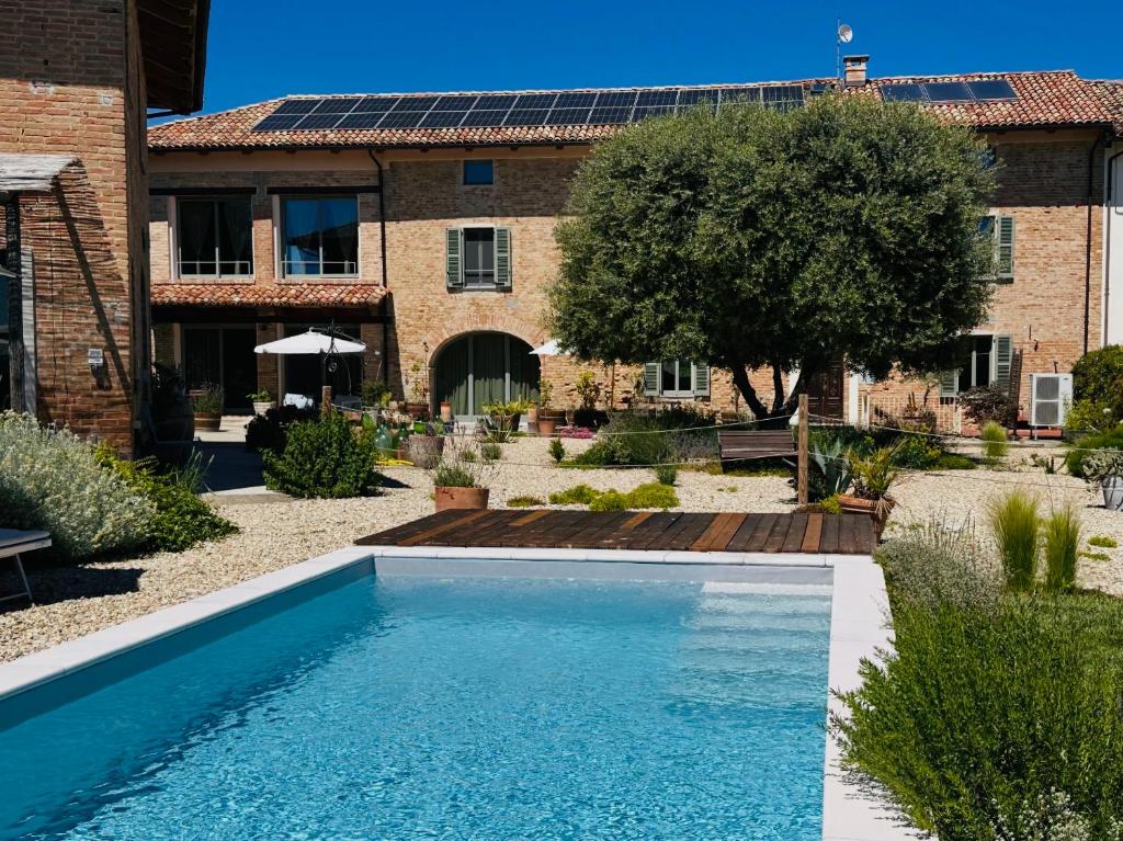 a swimming pool in the yard of a house at Bricco Aivè in Costigliole dʼAsti