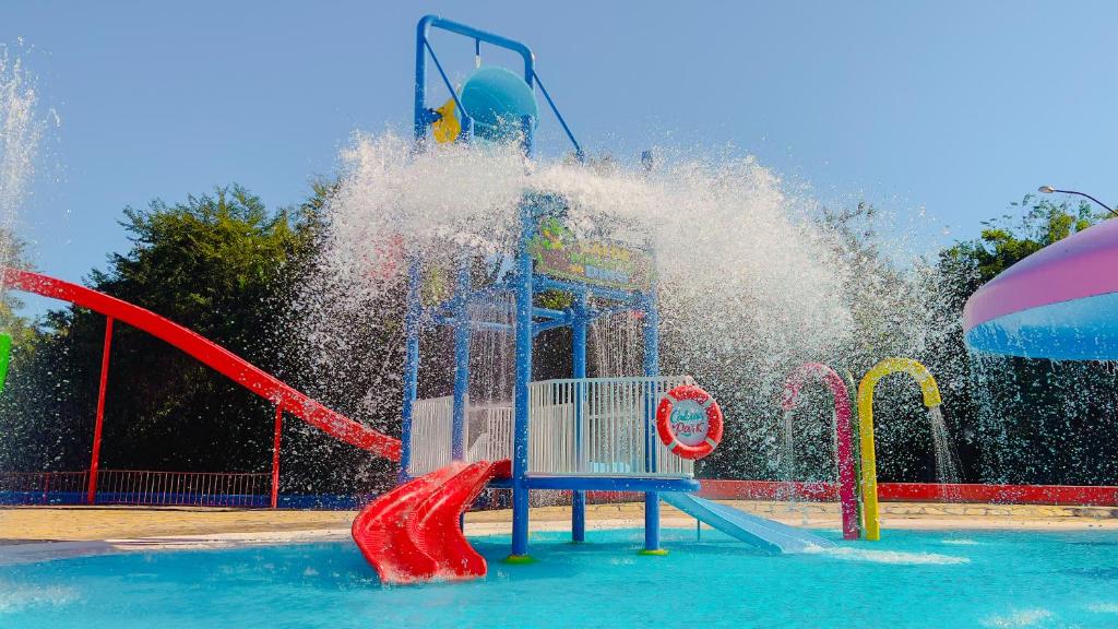 a water park with a playground with a slide at Caldas Park e Hotel - Caldas Novas in Caldas Novas