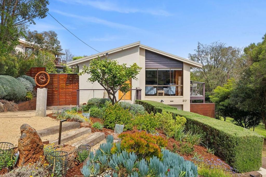 a house with a garden in front of it at BeachHaven in Aireys Inlet