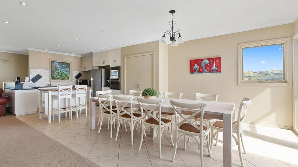 a kitchen and dining room with a table and chairs at Majestic Views in Marengo
