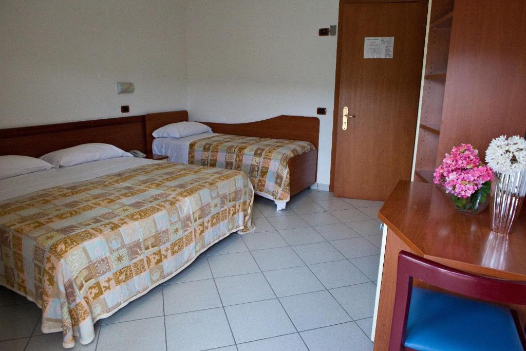 Postel nebo postele na pokoji v ubytování Hotel Clipper