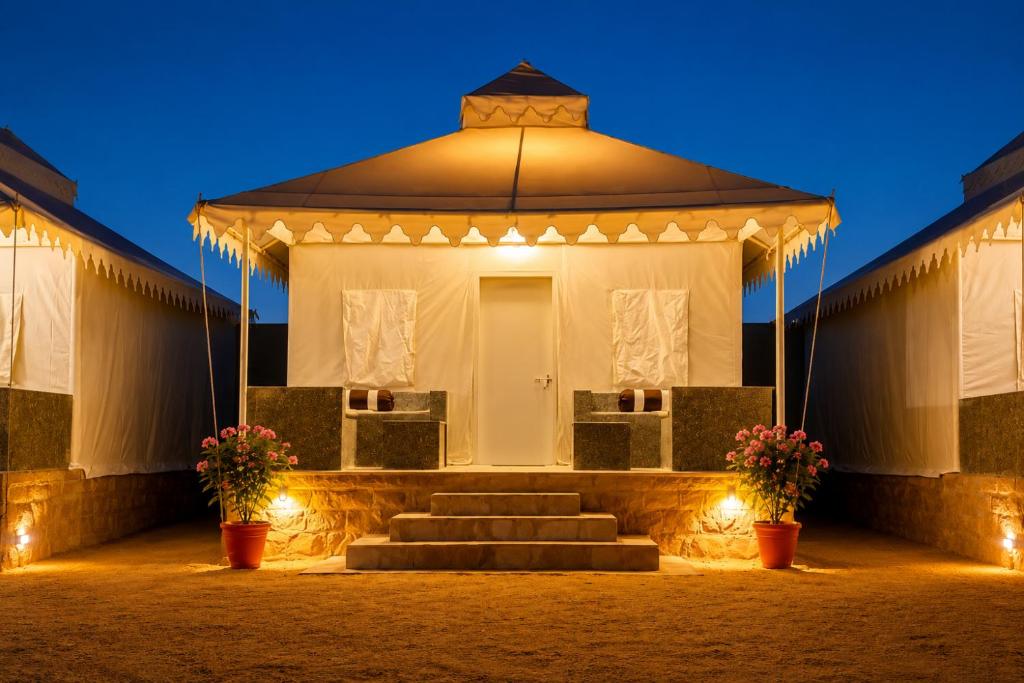 a gazebo with stairs and flowers and lights at Desert Luxury Camp & Resort Jaisalmer in Jaisalmer