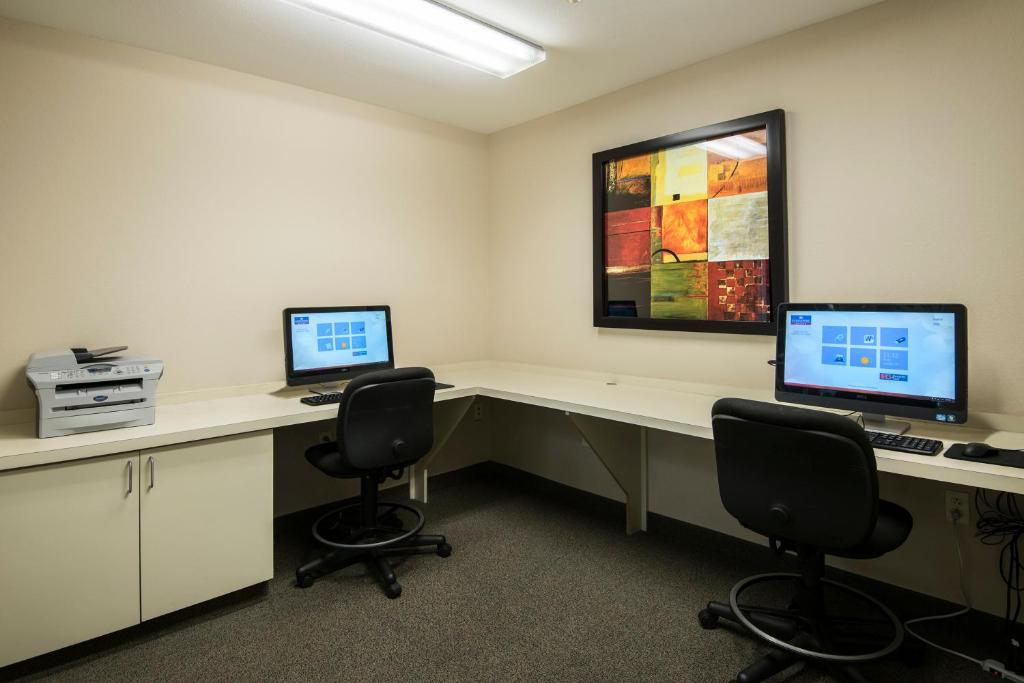 an office with two desks with two computers on them at Candlewood Suites Conway by IHG in Conway
