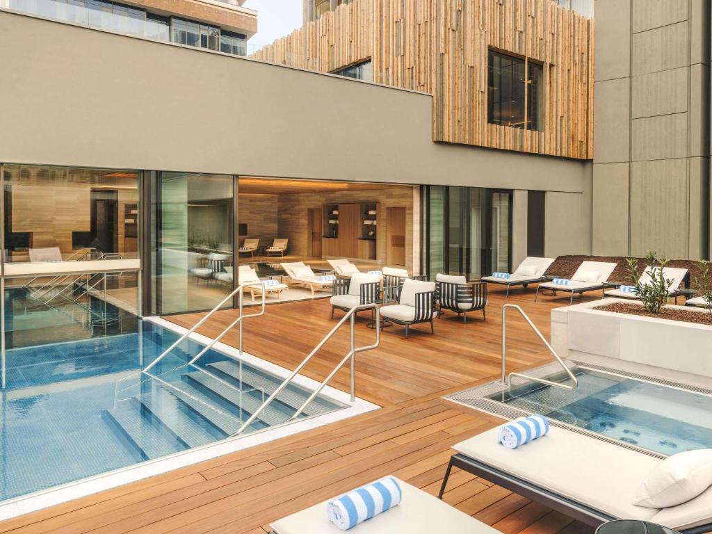 an outdoor patio with a swimming pool on a building at Fairmont Golden Prague in Prague