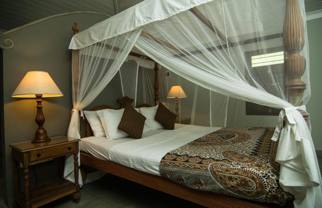 Un pat sau paturi într-o cameră la Villa Setha Wadi
