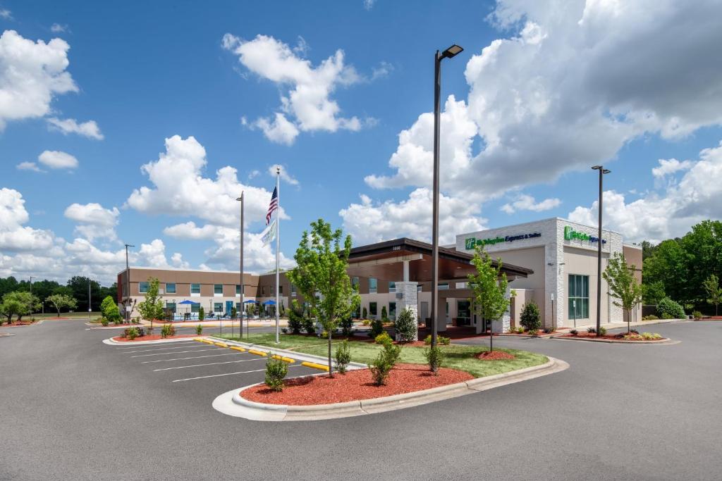 a rendering of the front of a hospital with a parking lot at Holiday Inn Express Wilson I-95 by IHG in Wilson
