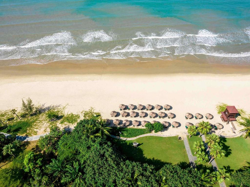 an aerial view of a beach with a group of animals at Pullman Oceanview Sanya Bay Resort & Spa in Sanya