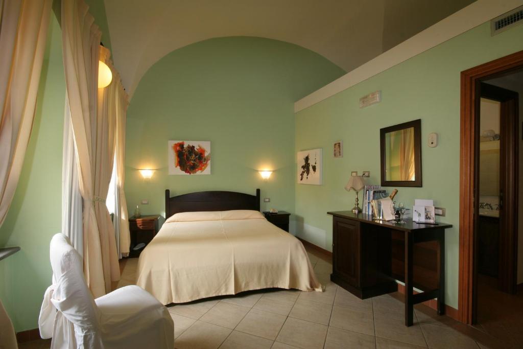 Postel nebo postele na pokoji v ubytování Hotel Il Duomo PHG