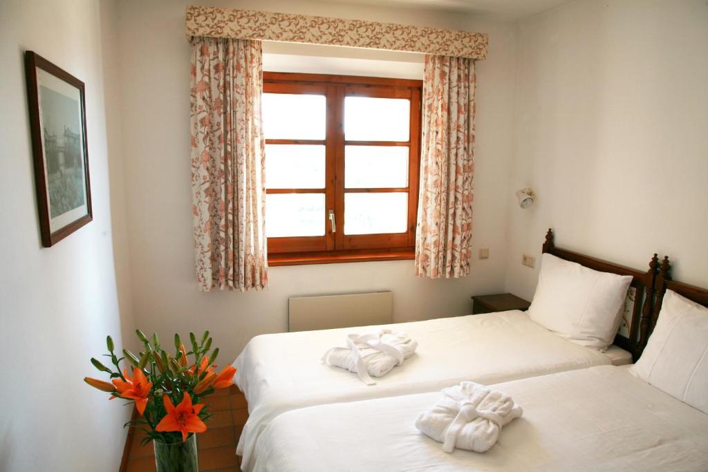 Postel nebo postele na pokoji v ubytování Hapimag Resort Mas Nou
