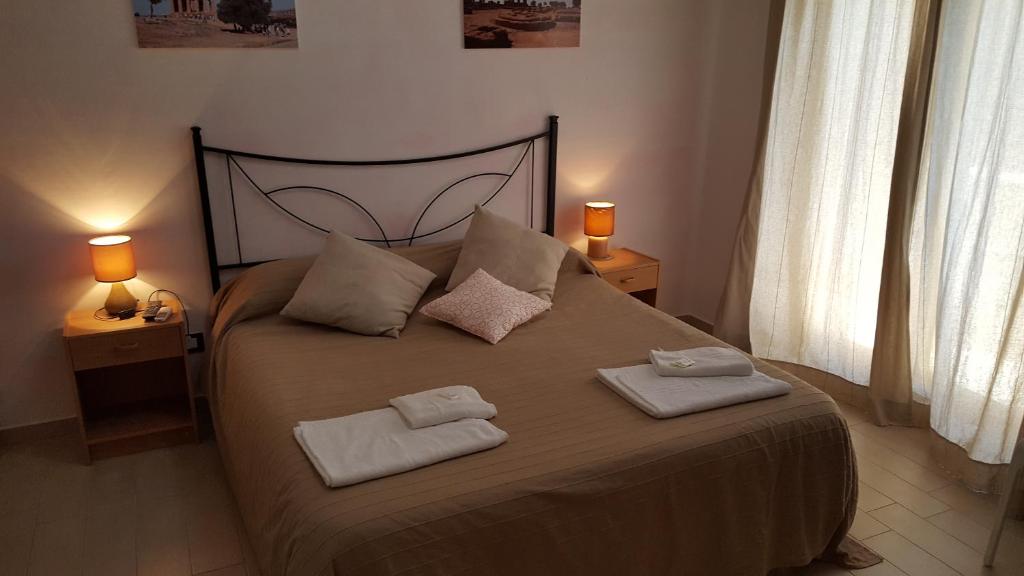 Postel nebo postele na pokoji v ubytování B&B Le Dune Beach
