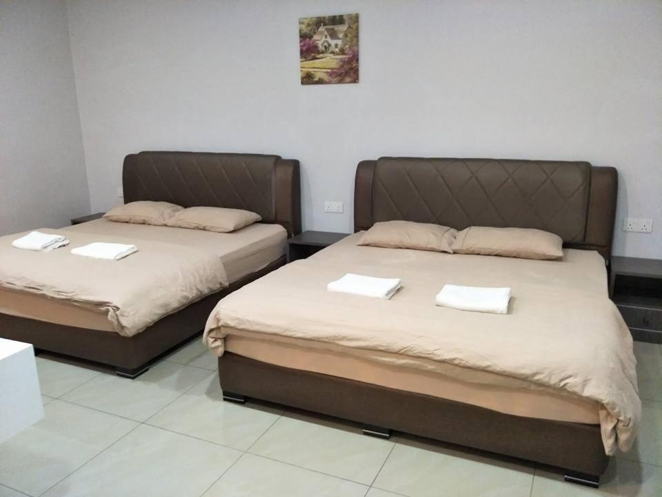 Postel nebo postele na pokoji v ubytování Lim Mini Hotel