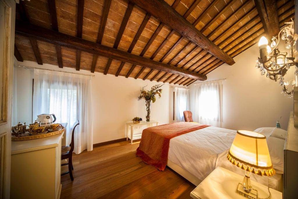 Postel nebo postele na pokoji v ubytování Agriturismo Le Volpi