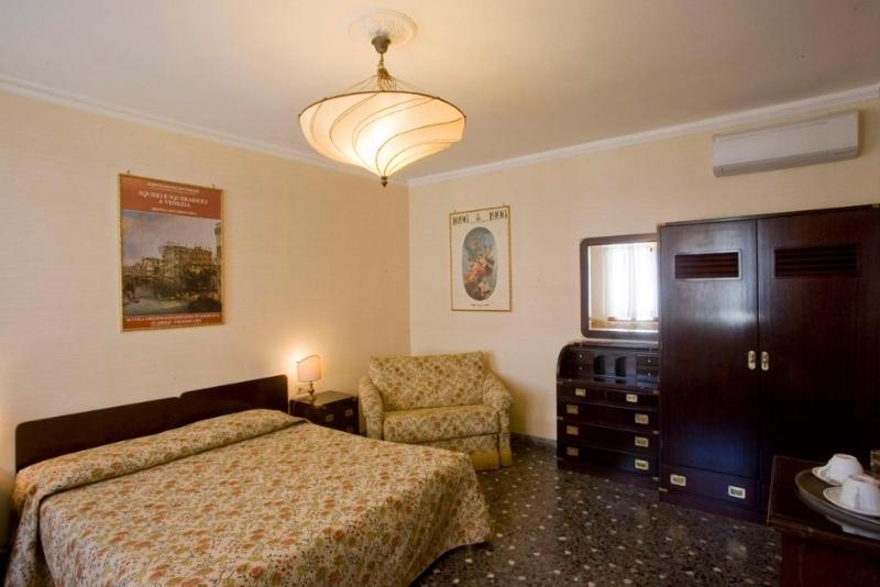 Postel nebo postele na pokoji v ubytování Hotel Agli Alboretti