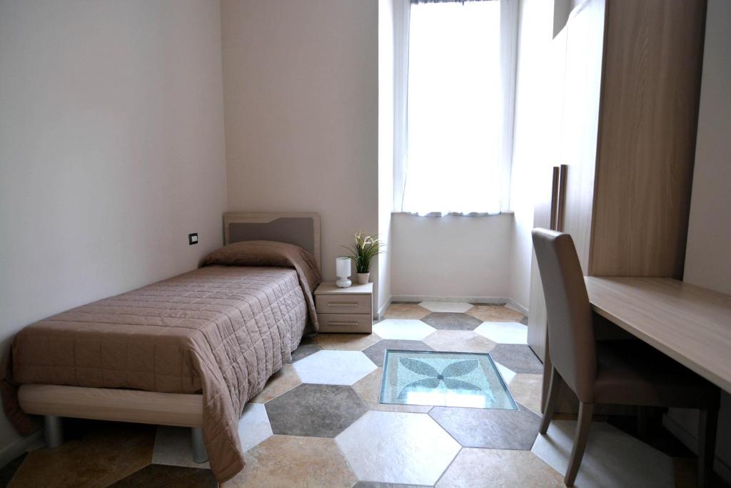 A bed or beds in a room at Residence Stendhal Guest House