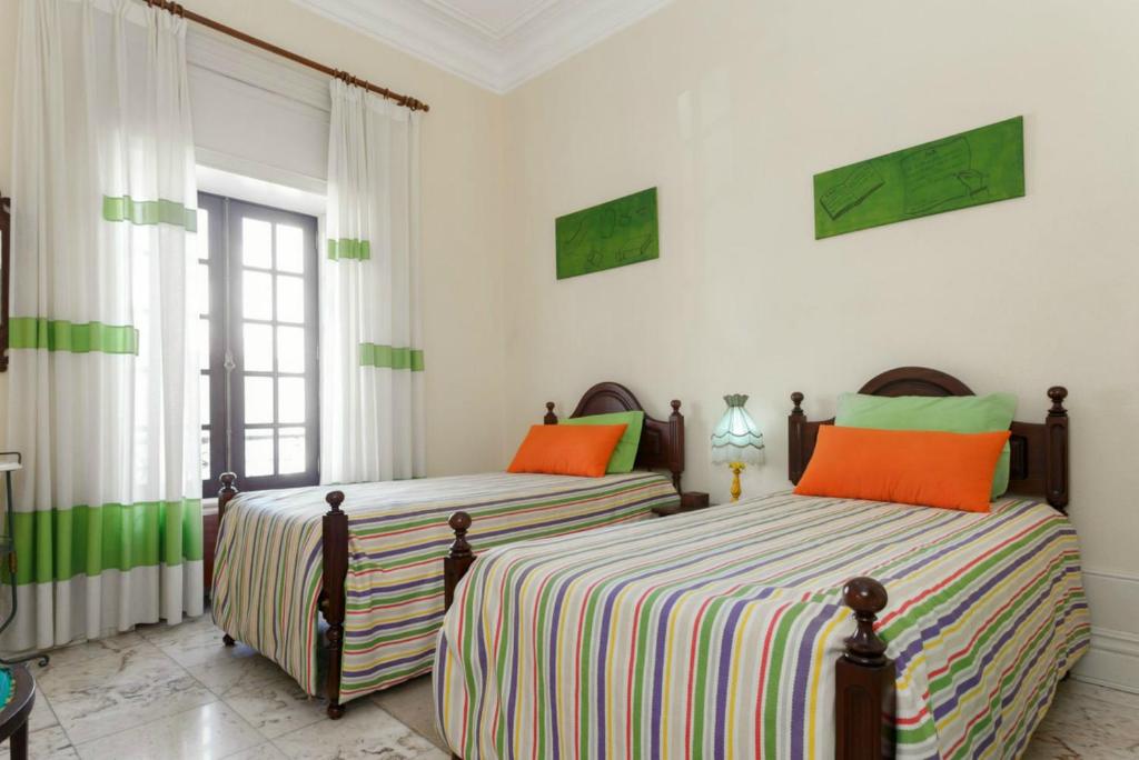 Postel nebo postele na pokoji v ubytování 18St. Hostel