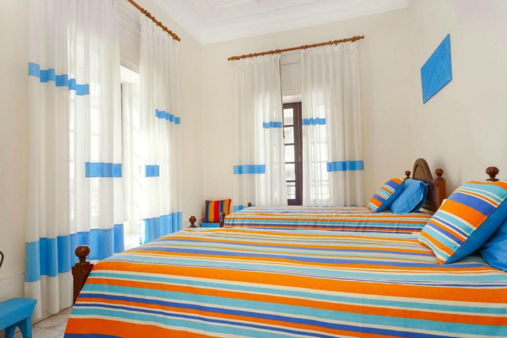 Postel nebo postele na pokoji v ubytování 18St. Hostel