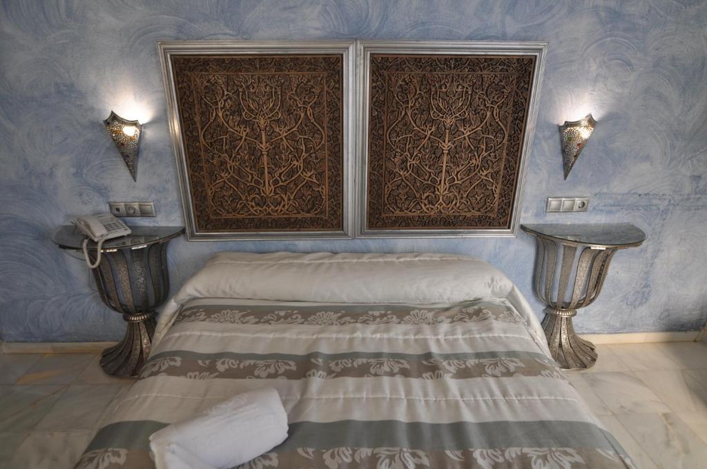 Postel nebo postele na pokoji v ubytování Hostal la Fuente