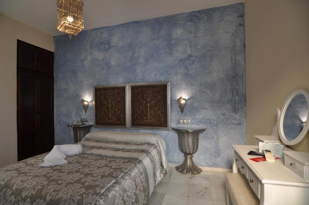 Postel nebo postele na pokoji v ubytování Hostal la Fuente
