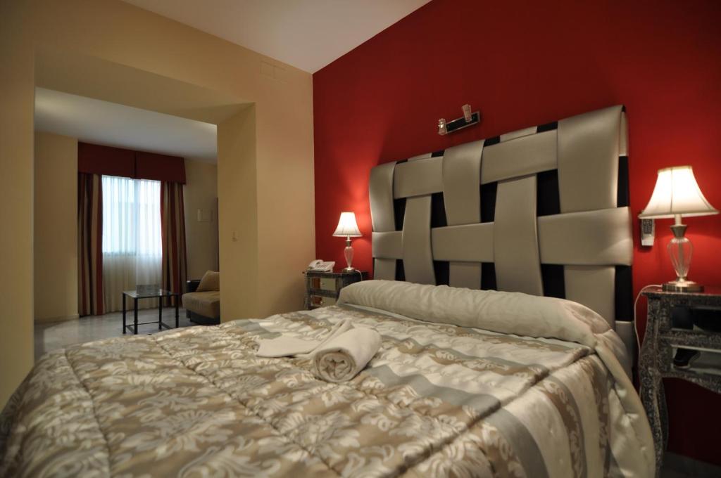 Postel nebo postele na pokoji v ubytování Hostal la Fuente