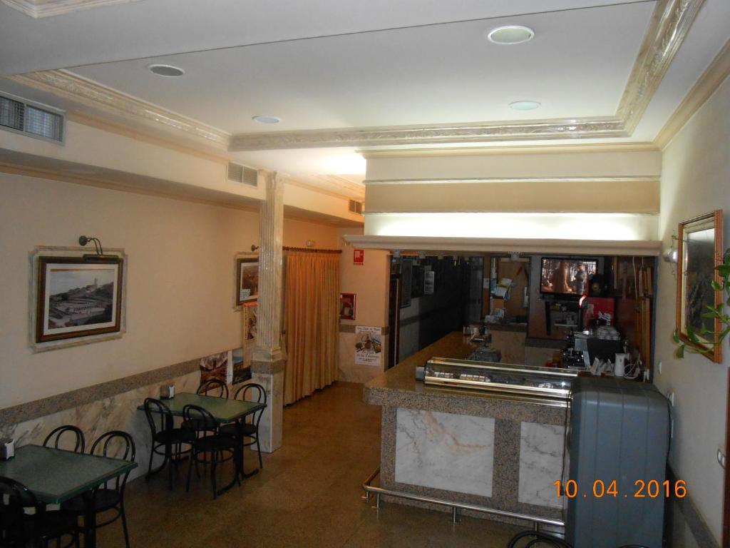 El vestíbulo o zona de recepción de Hotel Los Hermanos
