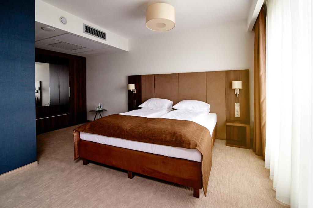 Postel nebo postele na pokoji v ubytování Hotel Imperiale
