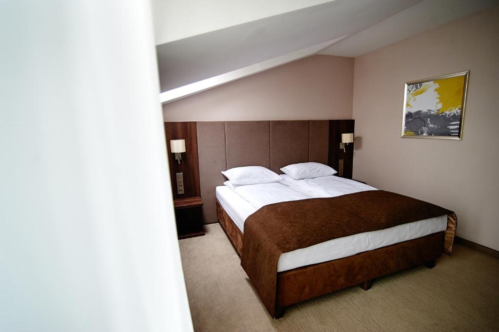 Postel nebo postele na pokoji v ubytování Hotel Imperiale