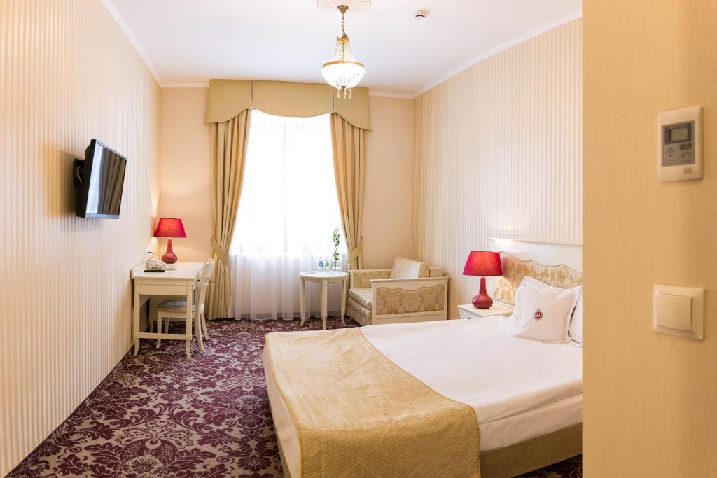 Posteľ alebo postele v izbe v ubytovaní Hotel Jarosław