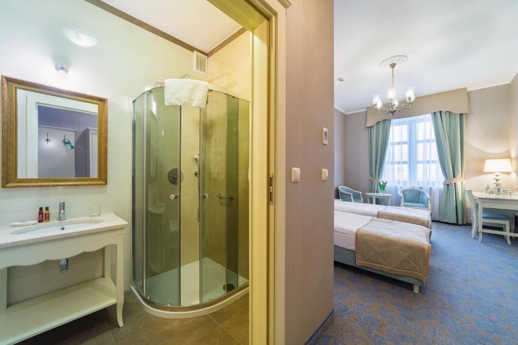 Posteľ alebo postele v izbe v ubytovaní Hotel Jarosław