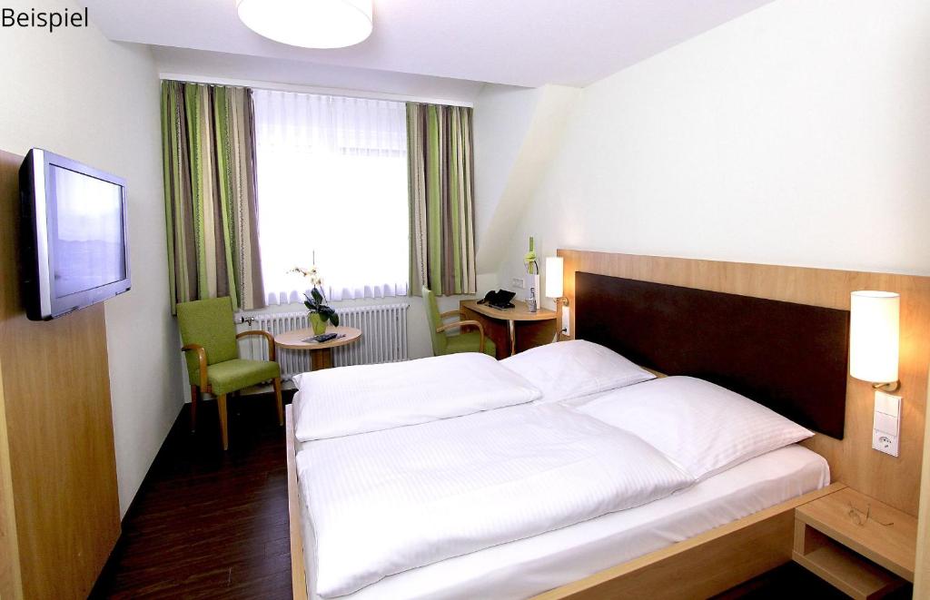 Postel nebo postele na pokoji v ubytování Gasthaus Seehof