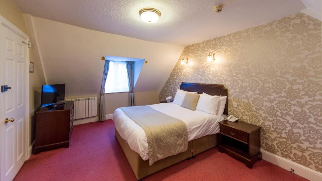 Postel nebo postele na pokoji v ubytování The Royal Hotel