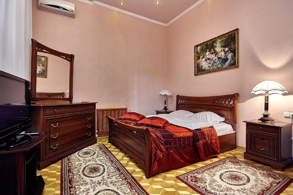 Кровать или кровати в номере Отель Версаль