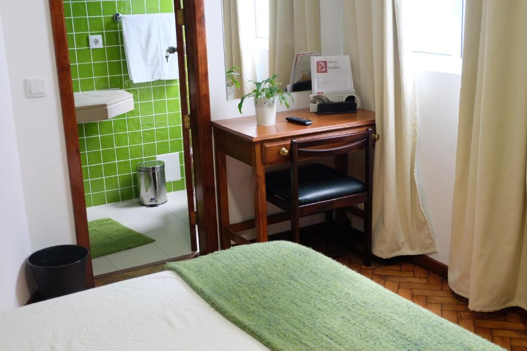 Postel nebo postele na pokoji v ubytování Hotel Alcides