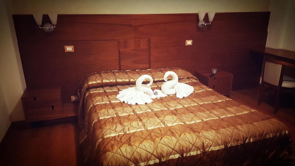 Postel nebo postele na pokoji v ubytování Hotel Gala