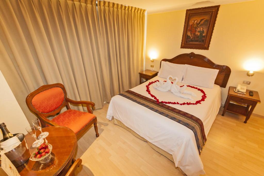 Rúm í herbergi á Hotel Agustos Cusco