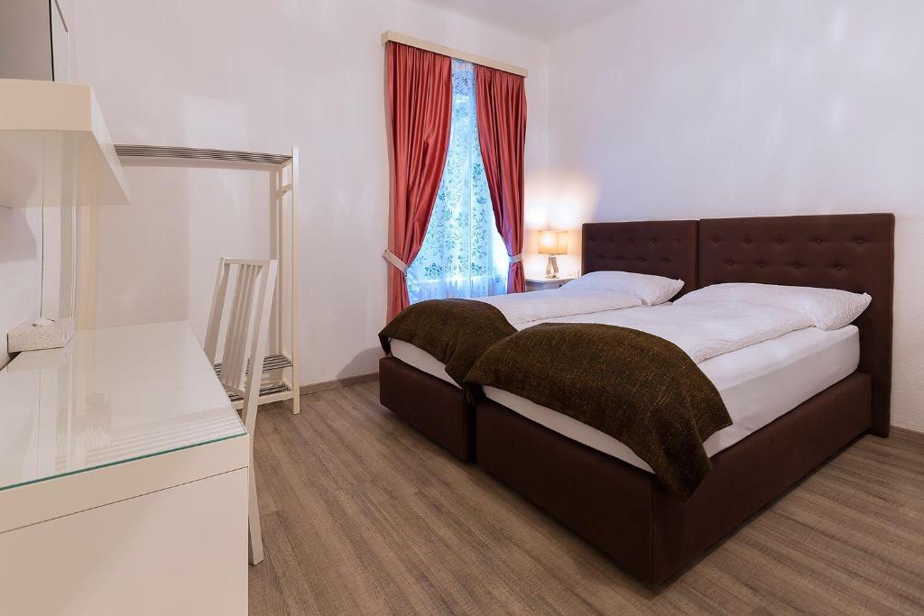Postel nebo postele na pokoji v ubytování Hotel Croce Federale