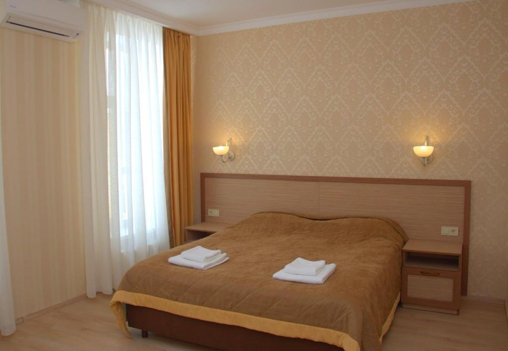 Postel nebo postele na pokoji v ubytování Staryj Kosiv