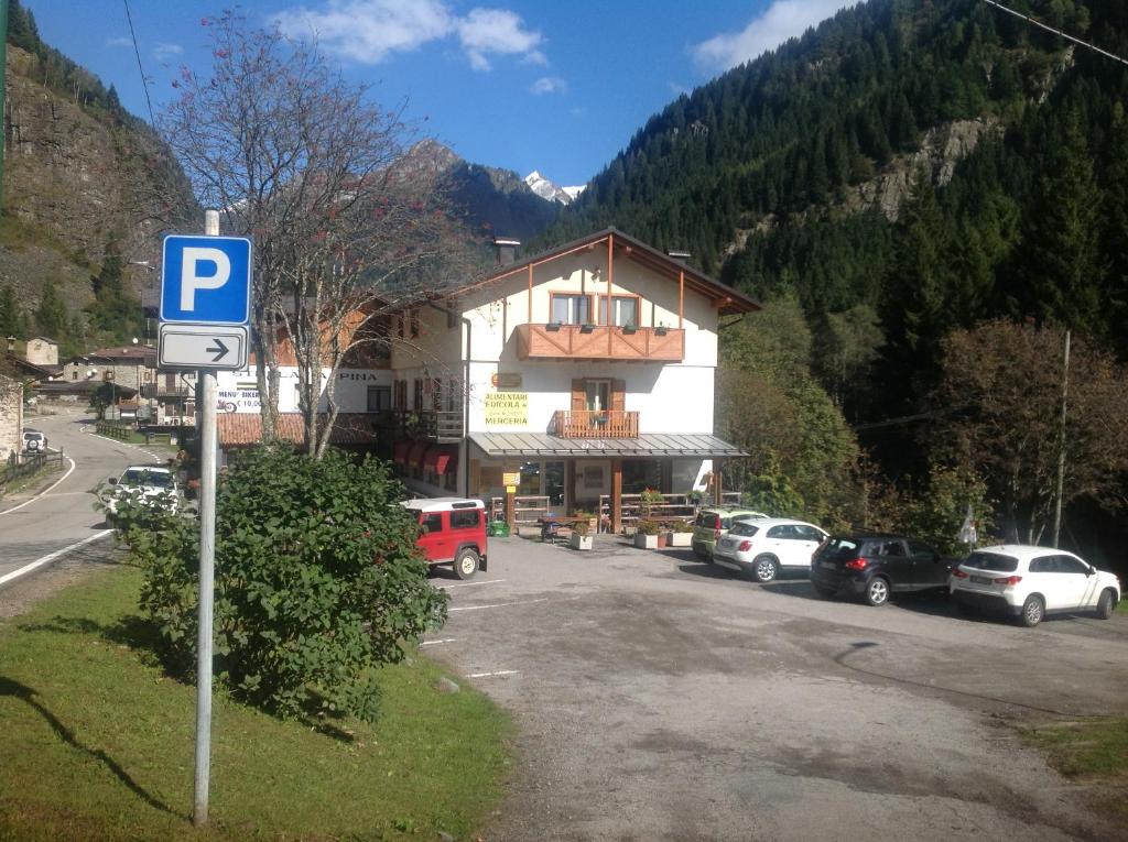 a parking lot in front of a large building at Affittacamere Valle Dorizzo di Scavoni Paolo in Val Dorizzo