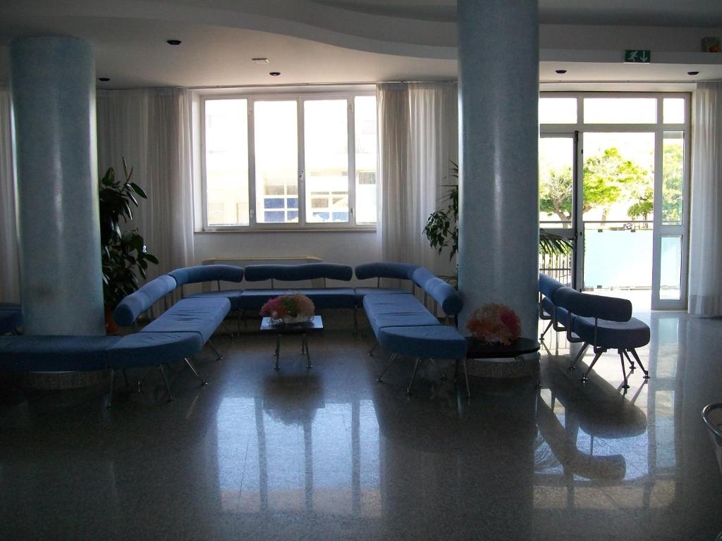 Postel nebo postele na pokoji v ubytování Hotel Maxim's