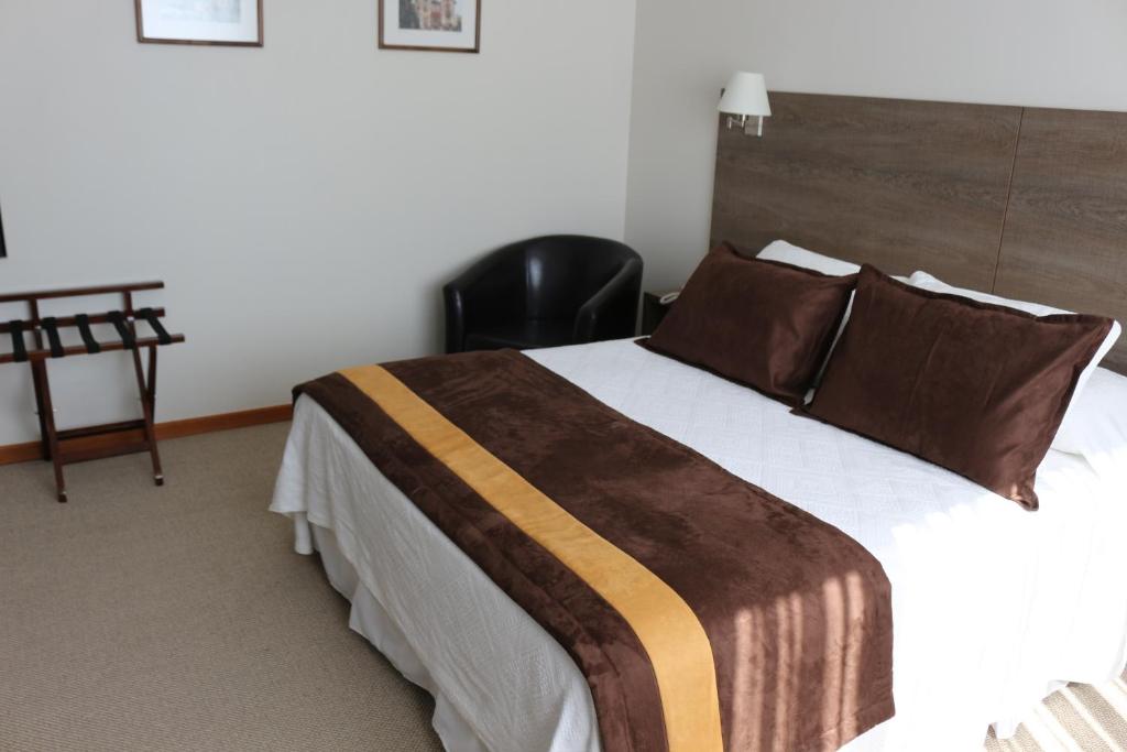 Postel nebo postele na pokoji v ubytování Conrado Hotel Osorno