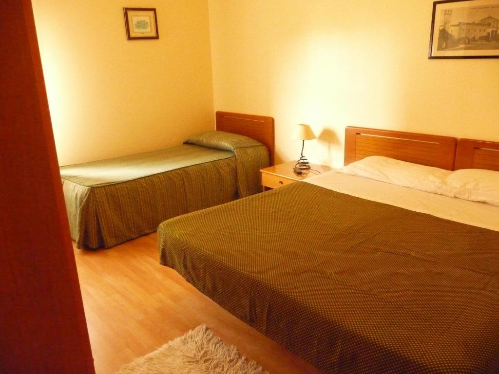 Postel nebo postele na pokoji v ubytování Agathae Hotel & Residence