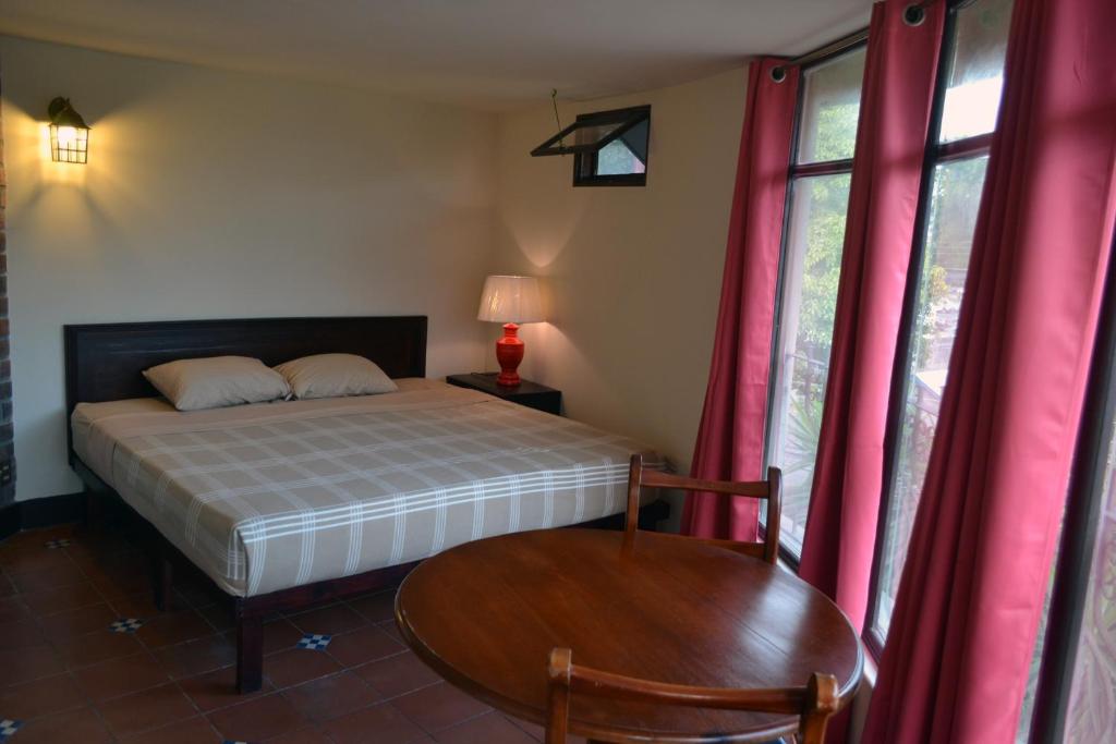 Postel nebo postele na pokoji v ubytování Hotel Columbus
