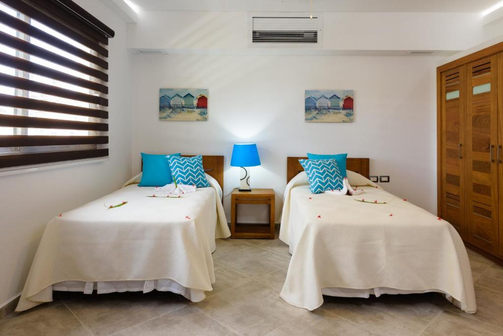 Postel nebo postele na pokoji v ubytování Aligio Apart-hotel & Spa - Las Terrenas