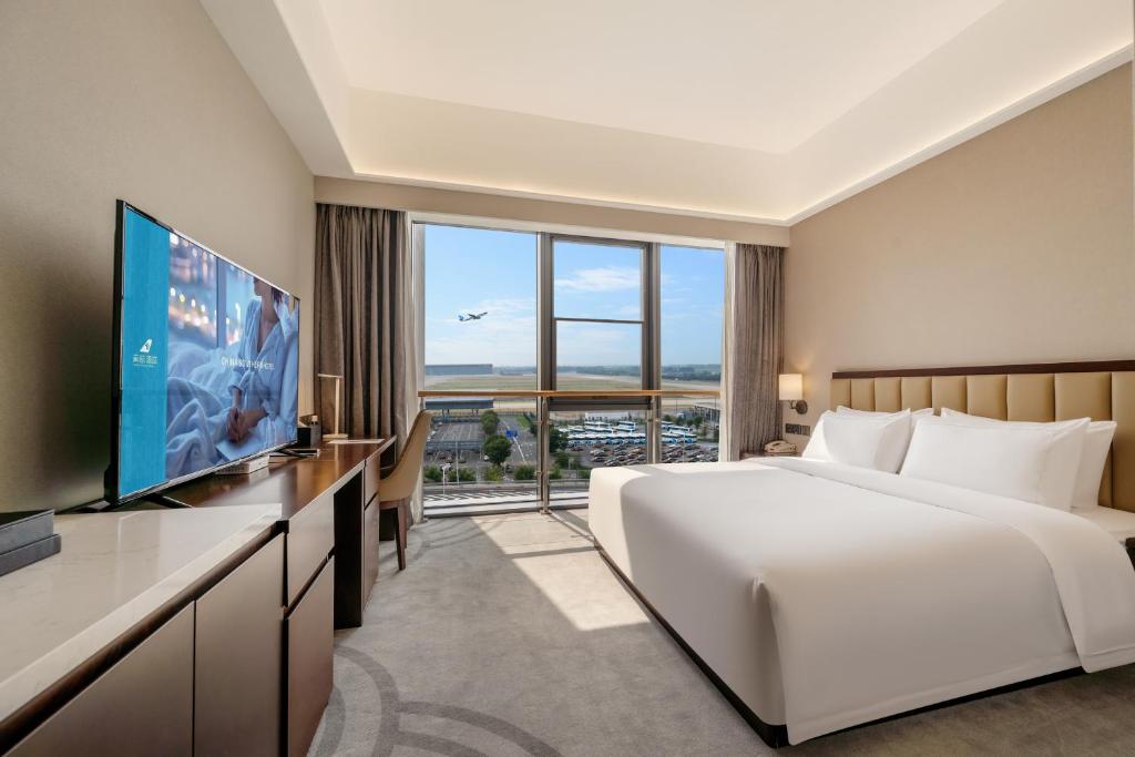 لابی و فضای عمومی Beijing CSN Pearl Hotel - تصویر ۵