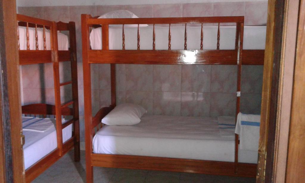 Postel nebo postele na pokoji v ubytování Ratih Bali Hostel