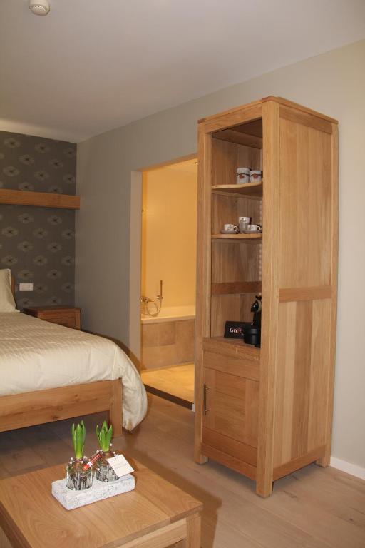 Postel nebo postele na pokoji v ubytování B&B Het KoeKoeKsnest Schelle