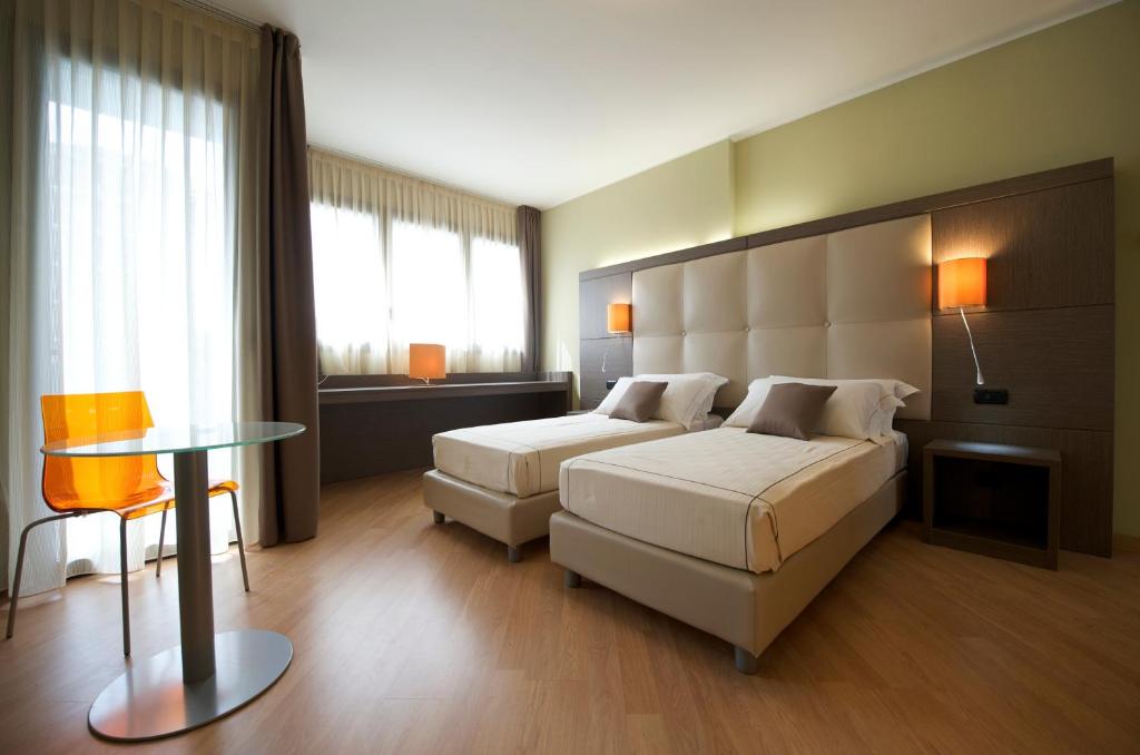 Postel nebo postele na pokoji v ubytování Acca Palace AA Hotels