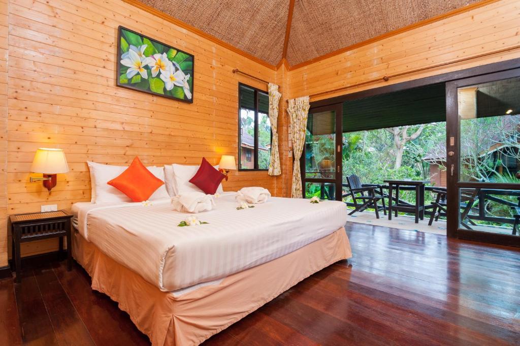 a bedroom with a large bed in a room at Palm Leaf Resort Koh Tao in Ko Tao