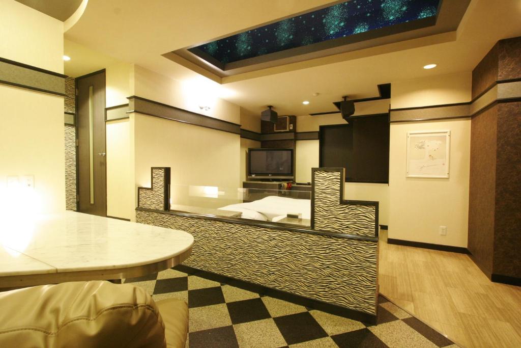 Postel nebo postele na pokoji v ubytování Hotel RR (Adult Only)